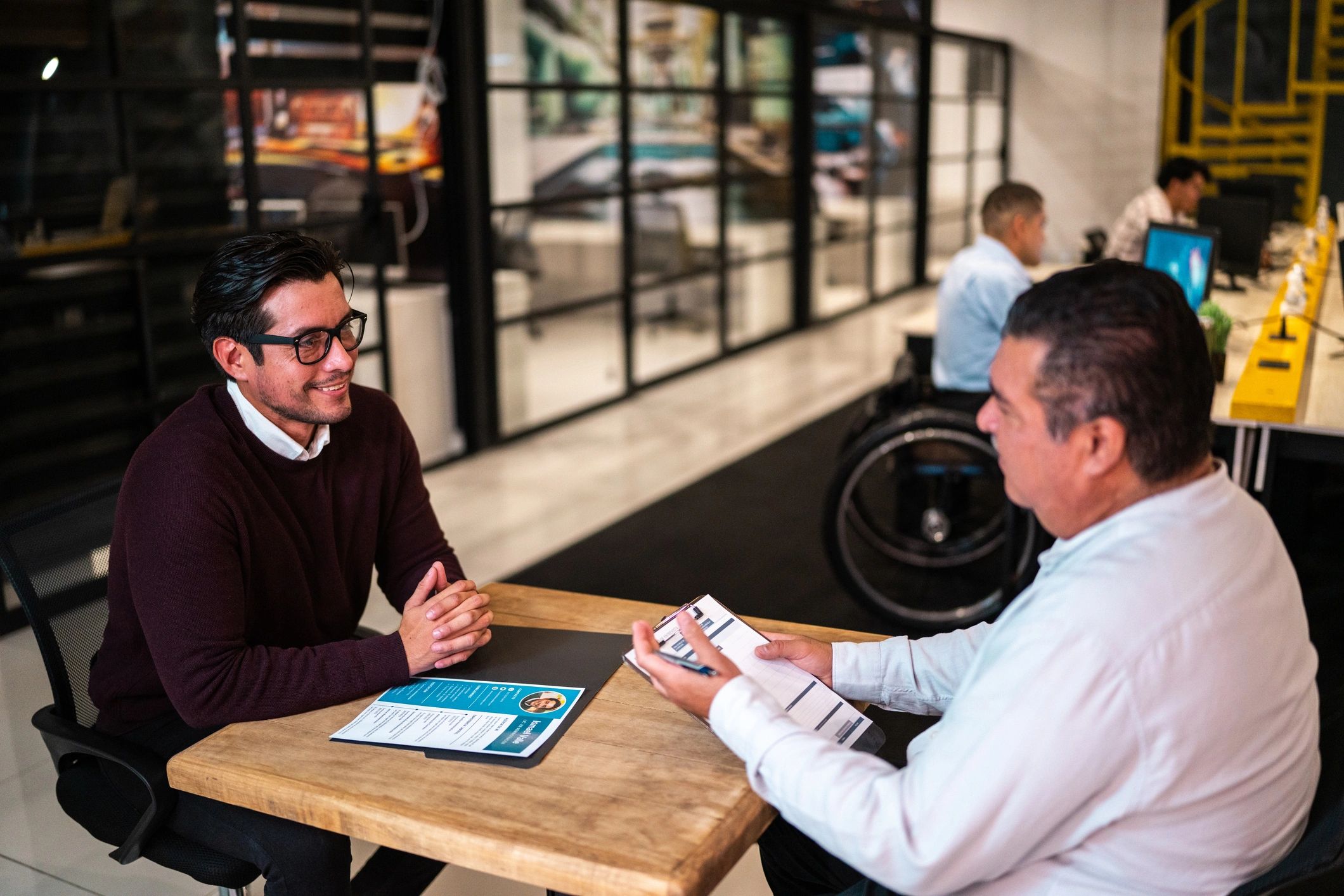 Recruiter interviewing a candidate in an office meeting